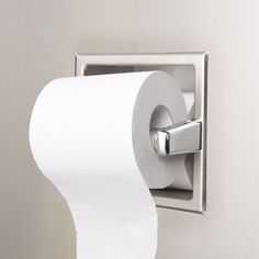 a toilet paper dispenser with a roll of toilet paper hanging from it