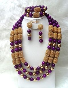 New Design Beautifully Embellished Purple with Gold Balls African Nigerian beads Set The complete Set is a Necklace, earrings and bracelet. Wedding Party Bridal Special Occasion.  It can b customised to your specification. It comes in silver or gold accessories. Colour subject to availability* This detailed Jewellery set makes you stand out elegantly on any special occasion. It's all about glamour and uniqueness.  Buying more than 1 Jewellery set, we offer wholesale and bulk prices for all our j