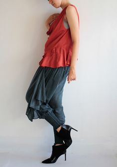 "Beautiful tank top/blouse that is great to pair with many of our pants. Sleeveless, cowl neck style, which can also be worn off the shoulder (picture 2) A loose fit, with great ruffled detail on the hem from the front to the back. Asymmetrical length. Wide armholes which also allow you to layer the piece over long sleeve/turtle neck for winter. Love the funky pants in the picture? Check out our wide range here: http://www.etsy.com/shop/cocoricooo/search?search_query=funky+pants&search_submi Casual Ruffled Camisole Blouse, Casual Viscose Sleeveless Blouse Tank Top, Casual Sleeveless Viscose Blouse, Casual Sleeveless Viscose Tank Top, Casual Viscose Sleeveless Blouse, Casual Sleeveless Blouse For Fall, Casual Sleeveless Fall Blouse, Casual Rayon Blouse For Layering, Casual Silk Bottoms For Summer