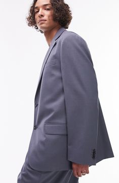 Stride through the office with confidence in this sleek jacket made with notched lapels and designed for a relaxed fit. 31" length (size 42) Two-button closure Notched lapels Nonfunctional four-button cuffs Chest welt pocket; front flap pockets Lined 69% polyester, 29% viscose, 2% elastane Dry clean Imported Classic Sport Coat With Flat Front For Office, Tailored Modern Blazer, Classic Flat Front Sport Coat For Office, Modern Tailored Blazer With Flat Front, Modern Tailored Blazer, Semi-formal Notch Lapel Sport Coat With Hidden Buttons, Single Breasted Suits With Lapel Collar For Business Casual, Classic Blazer With Welt Pockets For Career, Classic Career Blazer With Welt Pockets