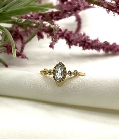 This beautiful and elegant gold plated ring has a mix of topaz and white cubic zirconia stones in 4 different sizes. The perfect gift for you or a loved one. Details ✔ 925 sterling silver with Gold Plated ✔ Stone: Topaz + white cz ✔ High Quality ✔ Non Tarnish ✔ Free polishing cloth for jewelry Jewelry Care ✔ Please be cautious with your jewelry. Some pieces are very dainty. It's possible to scratch/chip if you're not careful. ✔ Preserve your jewelry's shine by avoiding harsh chemicals such as be Stackable Cubic Zirconia Promise Rings With Center Stone, Luxury Cubic Zirconia Birthstone Wedding Ring, Elegant Open Topaz Ring For Anniversary, White Diamond Ring With Diamond Accents In Dainty Style, White Cubic Zirconia Dainty Rings, White Dainty Diamond Ring With Accents, White Dainty Cubic Zirconia Rings, Dainty White Diamond Ring With Accents, Dainty White Cubic Zirconia Rings