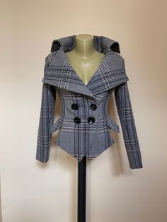 This is a very stylish and elegant wool plaid jacket . Leght  58 cm - at back. made of very soft and high quality woolen fabric. The jacket is fully lined. SIZE CHARTSIZE S  - US  6, UK 8, EU 36bust:  bust around 34.5”/90cmWaist:  waist around 27.5”/70cmHips: hips around 34.5”/90cmSIZE M  -  US 8, UK 10, EU 38bust: bust around 37.5”/95cmWaist:  waist around 29.5”/75cmHips:  hips around 37.5”/95cmSIZE L - US 10, UK 12, EU 40bust:  bust around 39.5"/100cmWaist:  waist around 31.5”/80cmHips:  hips Luxury Plaid Blazer For Formal Occasions, Luxury Plaid Outerwear With Notch Lapel, Elegant Houndstooth Blazer For Winter, Winter Houndstooth Double-breasted Blazer, Fitted Double-breasted Houndstooth Outerwear, Fitted Double-breasted Houndstooth Blazer, Fitted Long Sleeve Tweed Jacket For Winter, Elegant Plaid Wool Coat For Work, Tailored Plaid Outerwear With Lapel Collar