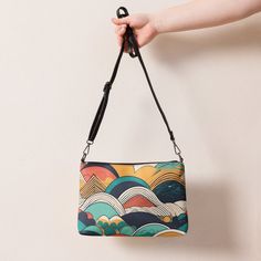 Retro Colored Abstract Pattern Crossbody Bag Elevate your style with our unique crossbody bag featuring a retro colored abstract pattern. Made of premium faux leather and lined with 100% polyester, this bag is both stylish and durable. The dark gray hardware adds a touch of sophistication, while the zip-top closure and multiple inside pockets keep your essentials secure and organized. What sets this crossbody bag apart is its versatility. With removable wrist and shoulder straps, you can easily Multicolor Crossbody Shoulder Bag For On-the-go, Multicolor Crossbody Shoulder Bag, Multicolor Crossbody Shoulder Bag With Mobile Phone Bag, Multicolor Crossbody Shoulder Bag With Removable Pouch, Colorful Crossbody Travel Bag, Colorful Crossbody Shoulder Bag For Travel, Multicolor Crossbody Shoulder Bag With Detachable Strap, Colorful Crossbody Shoulder Bag For Daily Use, Colorful Crossbody Bag With Adjustable Strap