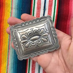 "This piece is a classic rectangular belt buckle with scalloped edges and lovely sterling silverwork. Great gift for an anniversary, birthday or an amazing wedding suit addition for a southwestern vibe. 49 grams for the entire piece 2.4\" long 3\" wide 2\" wide attachment for belt Signed by artist BLKGT and sterling silver hallmark. If you have questions about this item etc please ask before you purchase. Sold as-is, no returns or exchanges on any jewelry. Free domestic shipping Thanks for looki Vintage Silver Concho Belt Buckles, Artisan Engraved Belt Buckles For Gifts, Handmade Western Belt Buckles For Gift, Handmade Western Belt Buckles As Gift, Artisan Engraved Belt Buckles As Gift, Vintage Silver Rectangular Belt Buckles, Classic Silver Belt Buckles With Polished Finish, Artisan Silver Belt Buckle With Antique Detail, Handmade Artisan Silver Belt Buckles