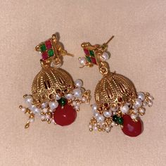 Imported From India, Ethnic Style Desi Bell Earrings In Bold Red And Emerald ***Check Out My Additional Desi/Pakistani/Gujarati Jewelry And Clothing In My Closet*** Nwot Never Used Traditional Red Drop Earrings, Red Jhumkas With Latkans For Eid, Red Drop Earrings For Festivals, Red Drop Earrings For Festive Occasions, Red Bollywood Jhumkas For Eid, Bohemian Earrings For Eid Festivities, Red Drop Earrings Danglers For Festive Occasions, Red Jewelry With Latkans For Eid, Traditional Green Earrings With Jewels