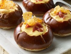 chocolate covered donuts topped with cheese and bacon