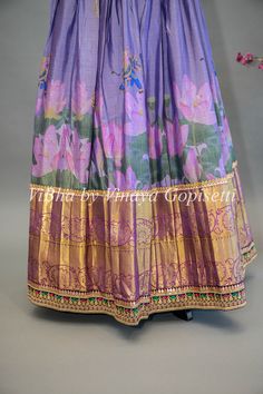 Indulge in the luxurious beauty of our Purple Floral Kanchi Silk Lehenga. With its intricately embroidered borders and delicate purple floral design, this lehenga is sure to make you the center of attention at any special occasion. Paired with a Kanchi Kalamkari Dupatta, experience an elegant fusion of traditional and modern styles. Transitional Multicolor Traditional Wear With Embroidered Border, Traditional Embroidered Full Length Anarkali Set, Traditional Full Length Embroidered Anarkali Set, Traditional Full-length Embroidered Lehenga, Traditional Full-length Semi-stitched Lehenga, Traditional Full Length Semi-stitched Lehenga, Traditional Embroidered Full-length Dupatta, Full Length Traditional Wear With Resham Embroidery For Festivals, Festive Full-length Embroidered Lehenga