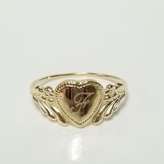 Thanks for shopping our vintage estate store. We tend to sell well below wholesale and truly hope you enjoy all of our items. Many of the items are one of a kind, so please enjoy scrolling through the pictures and hopefully something will catch your eye. Brown spots are from camera or reflections. Estate 14k yellow gold monogram cursive capital F heart ring. Custom made ring for our shop. Ring size: 3 Setting: 7.5mm 1/4" to 3/8" Band width: 1.4mm Weight: .95 gram Marked 14k and it's sweet. One that you will love. Classic Engraved Ring For Anniversary And Valentine's Day, Valentine's Day 14k Engraved Round Ring, Vintage White Gold Initial Ring For Promise, Vintage White Gold Initial Ring, Vintage Engraved Initial Ring For Promise, Vintage Engraved Promise Ring With Engraving Option, Engraved Vintage Initial Ring For Promise, Vintage 14k Stamped Promise Ring Jewelry, Vintage 14k Stamped Promise Ring