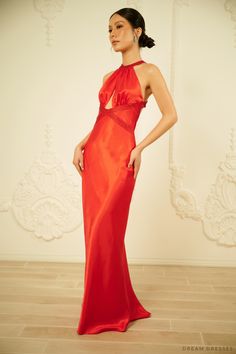 Feel glam and luxurious adorned in our Lucia red silk evening dress with halter neck detailing. Ideal for a rehearsal dinner, make a bold entrance in this stunning gown. Lucia features a cut-out detailing in the front and open back adding a sultry flair while keeping the overall look sophisticated and classy. Beading work along the neckline and waist add a subtle sparkle and shine. The dress: Color: red Neckline: halter neck with cut-out Back: open back with straps Details: beadings on neckline Halter Neck Maxi Dress With Keyhole Back For Evening, Halter Neck Evening Dress With Keyhole Back, Elegant Evening Halter Dress With Keyhole Back, Halter Neck Evening Dress With Keyhole Back For Gala, Elegant Formal Halter Dress With Keyhole Back, Silk Halter Neck Gown For Gala, Floor-length Evening Dress With Keyhole Back For Prom, Formal Halter Neck Evening Dress With Keyhole Back, Evening Dress With Keyhole Back In Maxi Length