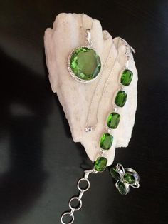 Make a great gift of sparkling jewelry to a friend or loved one. This sparkling Peridot set has great color, fire and displays sharp brilliance. Dating back to ancient Egypt, Peridot was a favorite of Cleopatra, who wore the stone for its beauty and to ward off evil spirits. According to legend, the Queen's emeralds were actually Peridot crystals, which share a similar aesthetic to the highly prized jewel. It is known as the poor man's Emerald because of its less expensive price. Selling for $14 Mens Tassel Loafers, Ward Off Evil Spirits, Sparkling Jewelry, Peridot Crystal, Necklace Ring, Hand Painted Leather, Sparkle Jewelry, Painting Leather, Evil Spirits