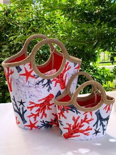 two red and white buckets sitting on top of a table