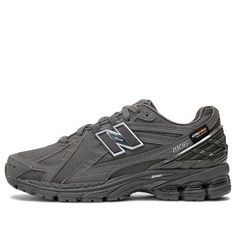 The New Balance 1906R Cordura 'Magnet' is a sleek and stylish sneaker designed for everyday wear. Its rubber sole and Cordura upper provide superior comfort and durability, while its dark gray colorway adds a subtle yet eye-catching touch. The 1906R is perfect for casual outings, outdoor activities, and everything in between. Its unique design is inspired by the classic 1906 silhouette, and its protective toe cap ensures your feet stay safe no matter where your day takes you. With its timeless style and reliable construction, the New Balance 1906R Cordura 'Magnet' is the perfect choice for any active lifestyle. (SNKR/Retro/Unisex/Low Top/Non-Slip/Breathable/Wear-resistant) Gray Sneakers With Vibram Sole Medium Fit, Gray Sporty Sneakers Medium Fit, Gray Sneakers With Vibram Sole And Medium Fit, Gray Sneakers With Vibram Sole, Gray Lace-up Sneakers, New Balance Sneakers With Abzorb Midsole For Errands, Gray New Balance Lace-up Sneakers, Gray High-top Running Shoes With Branded Insole, Gray New Balance Running Shoes With Rubber Sole