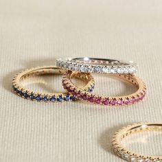 This modern take on an eternity ring features a full circle band of delicate yet sparkly natural emerald gemstones from the Juliette Maison™ collection. Fashioned in 10K rose gold, Wear to add a subtle sparkle to any finger, or style as an accent to your go-to stack of rings. Stackable Everyday Luxury Rings, Rose Gold Half Eternity Stackable Rings, Luxury Rose Gold Round Eternity Band, Rose Gold Round Cut Eternity Band With Halo, Rose Gold Halo Round Cut Eternity Band, Fine Jewelry Rose Gold Eternity Band With Prong Setting, Rose Gold Stackable Eternity Band, Rose Gold Eternity Band With Halo, Rose Gold Half Eternity Band Fine Jewelry