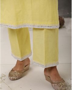 Description: Linen kurta paired with straight pants, both hemmed with ivory anchor embroidery. Enhanced with a statement neckline with anchor embroidery, it makes a truly mesmerising vision.Colour Yellow/PeachFabric LinenCare Dry Clean onlyFit Tailored Summer Salwar Kameez With Embroidered Border, Summer Chikankari Embroidery Straight Kurta Pant Set, Summer Straight Kurta With Embroidered Hem, Summer Pant Set With Resham Embroidery And Straight Kurta, Festive Summer Kurta With Embroidered Hem, Cotton Sharara With Embroidered Border And Straight Kurta, Summer Designer Chikankari Embroidery Pant Set, Summer Straight Kurta Pant Set With Resham Embroidery, Linen Straight Kurta Set For Summer