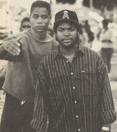 two young men standing next to each other