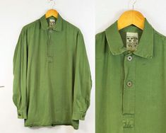 "True vintage Swedish military smock tops from the 1960s-80s, made from a soft cotton with grandad style button down neckline, button cuffs and curved hem. We only have a very small batch of these with no chance of re stock right now, so quantities are limited. - Soft worn in cotton - Loose, comfy fit - Dip hem design - True vintage from the Swedish army - Fabric is 100% cotton SIZING XS - fits chest 34\" Small - fits chest 36\", Medium - fits chest 38\"-40\", Large - fits chest 42\"-44\" XL - f Vintage Cotton Tops With Placket, Military Style Collared Cotton Top, Vintage Long Sleeve Top With Placket, Spring Military Style Tops With Buttons, Vintage Tops With Button Cuffs For Daywear, Smock Tops, Vintage Henley, Swedish Army, Capri Trousers