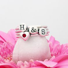 "We love this sweet sentiment of pairing an initial with a birthstone. This stacking initial and birthstone ring set is the perfect gift for the mother or grandmother. Or, wear your own initial and birthstone! **This listing comes in sets of two - each set having an initial ring and a birthstone rings. You can order multiple sets. ** Need a different combo of rings in your set? Create your own set here: https://www.etsy.com/listing/230740149 These rings are also available in 24K gold at this lis Personalized Couples Rings As Gifts, Personalized Initial Ring For Valentine's Day Anniversary, Personalized Initial Ring For Anniversary On Valentine's Day, Personalized Couple Rings For Valentine's Promise, Personalized White Stackable Rings For Anniversary, Personalized Couple Rings As Gift, Personalized Pink Ring For Birthday, Personalized Couple Rings For Gift, Personalized Couple Rings For Gifts