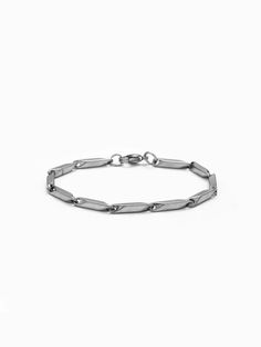 Explore our Men's Chain Bracelet, a blend of subtlety and strength. This dainty yet durable bracelet, crafted from stainless steel, features a unique twisted chain design. Perfect for wearing alone or as part of a layered look, it's a stylish piece that resonates with modern masculinity. Stainless Steel Chain Link Bracelet For Everyday, Minimalist Sterling Silver Bracelet With Solid Link, Minimalist Everyday Bracelet With Stainless Steel Clasp, Minimalist Stainless Steel Oval Link Chain Bracelet, Minimalist Stainless Steel Silver Chain Bracelet, Modern Bracelets With Stainless Steel Clasp And Rectangular Links, Classic Stainless Steel Oval Link Bracelet, Modern Everyday Chain Bracelet With Stainless Steel Clasp, Everyday Stainless Steel Bracelet With Rectangular Links