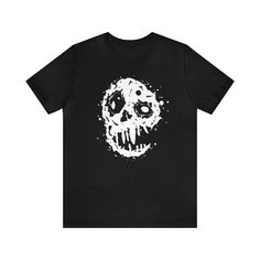 a black t - shirt with a white skull on it