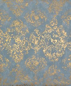 a blue and gold wallpaper with an ornate design on the bottom half of it