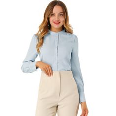 This solid-color shirt has a classic design, a staple in any office wardrobe. The delicate slightly striped texture becomes a standout detail on the classic silhouette of this white button-down, featuring a stand collar and long sleeve. This spring long-sleeved shirts feature a subtle striped texture, long sleeves with button cuffs, and a stand collar. The button-down shirt gets an elegant, office vibe update with a classic stand collar and straight silhouette. Pleats at the shoulders enhance th Light Blue Button-up Dress Shirt For Office, Fitted Light Blue Button-up Blouse, Elegant Light Blue Button-up Shirt, Light Blue Solid Color Button-up Top, Light Blue Button-up Shirt With Button Cuffs, Office Wardrobe, Velvet Blouses, White Button Down, Sleeve Packaging