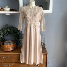 New With Tags Zara Lace Pleated Midi Dress Beige/Pink Size: Xs Chest: 31.5” Waist: 28” Length: 43” Back Zipper Lined 3/4 Sleeves Polyester Beige Sheath Dress For Spring, Pink Pleated Midi Length Dress, Beige Pleated Spring Dress, Pink A-line Lace Dress For Spring, Beige Midi Lace Dress For Spring, Spring Beige Fitted Lace Dress, Beige Lace Midi Dress For Spring, Fitted Beige Lace Dress For Spring, Spring Pleated Sheath Midi Dress