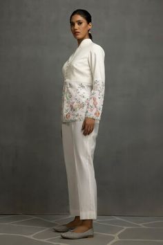 White top in linen base with floral and tabla instrumental embroidery in thread, sequins and beads. Paired with a pant. - Aza Fashions Traditional Embroidered Formal Pant Set, Floral Embroidered Sets For Spring Reception, Fitted Traditional Pant Set For Spring, Floral Embroidery Sets For Spring Reception, Spring Floral Embroidery Sets For Reception, Traditional Fitted Pant Set With Floral Embroidery, Spring Floral Embroidery Palazzo Set For Reception, Fitted Cotton Pants For Wedding, Fitted Cotton Wedding Pants