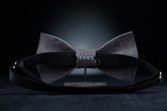 "Stylish and fashionable accessory is great for so many occasions! Our bow ties are made with love from 100% Full Grain Leather, with adjustable neck strap. The mission of this accessory is to raise the mood and self-confidence of its owner, to give a sense of style! Material: 100% Full Grain Leather Color: Stone Gray Design: minimalist Style: unisex Size ADULT): - 6x11 cm. (2.3x4.3\") - strap is regulated; - the width of strap is 1.5 cm. (3/4\"). Size YOUTH): - 5x8 cm. (1.9x3.1\") - strap is re Silver Ties For Father's Day Gift, Elegant Bow Tie With Butterfly Knot As Gift, Classic Bow Tie For Gifts, Dapper Ties As Gifts, Classic Bow Tie Gift, Dapper Standard Ties For Gift, Dapper Standard Ties As Gifts, Silver Tie For Gift, Silver Tie As A Gift