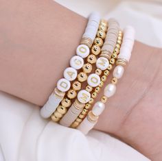 These Bracelets can be perfect for you or for a gift. They will look pretty in your hand.♡  ♡Perfect Gift for Mom, Grandma, birthday or bridesmaid♡ ⭐︎ Details: ♡ Glass Bead ♡ Gold Plated Beads and Discs 18k(Resistant to tarnish or fading). ♡ Nylon Elastic ♡ AAA Fresh Water Pearls C A R E ∙ T I P S To maintain the quality of your new Velvet Collection jewelry, please: * Remove when sleeping, exercising, or doing other physically strenuous activities * Avoid direct contact with perfumes, body oils Bracelets For Mom, Personalized Bracelet For Her, Mom Bead Bracelets, Trendy Bracelets For Mother's Day, White Charm Bracelet With Colorful Beads For Jewelry Making, Mrs Beaded Bracelet, White Stackable Beaded Bracelets For Jewelry Making, Mothers Day Bracelets, Bohemian White Bracelets For Mother's Day