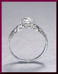 an engagement ring with three stones on it