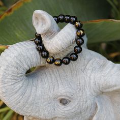 This is a mystical crystal beaded Mala bracelet, with the fusion of black onyx with the power of a Tibetan Buddhist Symbols -- 6 of the onyx beads are engraved the golden symbols! It gives the Peace, the Power, and the Protection to the person who wear it. Size(this brace let comes in 3 sizes, please select carefully):Size(this brace let comes in 3 sizes, please select carefully): -----Small: Bead diameter: 3/8 inch (10 mm) Bracelet circumference: 6 inch (15 cm) -----Medium: Bead diameter: 1/2 i Bracelet Man, Buddhist Mala, Buddhist Symbols, Buddhist Prayer, Meditation Bracelet, Prayer Bracelet, Black Onyx Bracelet, Bracelet Mens, Tibetan Buddhism