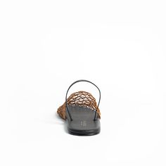 Indulge in the luxurious texture of a woven sling back that exudes warm-weather charm. This breezy sandal boasts a cushioned footbed for ultimate comfort. Color: Nutella Fit- True to size Flat Synthetic Upper Leather Lining Padded Footbed Man-made Sole Luxury Woven Leather Ankle Strap Sandals, Brown Woven Leather Open Toe Slides, Artisan Woven Leather Slip-on Sandals, Adjustable Woven Leather Slip-on Sandals, Bohemian Woven Leather Slip-on Huarache Sandals, Flat Wedges, Flat Heel Boots, Sling Back, Comfort Color