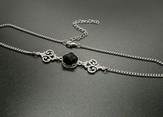 "Delicate victorian style choker featuring a genuine onyx stone sitting in an ornate bezel setting. The middle piece is set inbetween two beautifully detailed ornate connectors. The choker works fine on its own or stacked with another necklace. The chain is made of long lasting stainless steel and other components of high quality silver plated metal.  Stone:  12mm diameter Please choose your length in the drop down menu. Length = chain length including the clasp. Comes with an additional strong Gemstone Choker, Necklace Elegant, Gothic Style, Onyx Stone, Style Necklace, Chain Choker, Gothic Fashion, Victorian Fashion, Chain Lengths