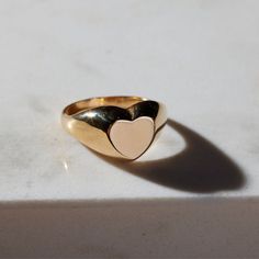 The timeless Girlfriend Signet Ring combines classic sophistication with playful spirit. The curved thick band is molded to a statement heart shape, which offers a refined aesthetic sure to be admired. The 18-karat gold filled ring is electroplate finished to provide a luxe and long-lasting finish, able to withstand water and more! Nickel And Suede, Refined Aesthetic, Pearl Necklace Earrings, Wear Necklaces, Ring Shapes, Gold Filled Ring, Pearl Gemstone, Keep Jewelry, Crystal Pearls