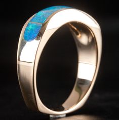 14k Yellow Gold AA Opal Inlay Wave Style Ring 7.2gMetal Information: 14k Yellow GoldTotal Weight: 7.2gBand Width: 3.3mmSize: 9.75Stone InformationMain StoneGem Type: OpalShape: InlayColor: MultiClarity/Quality: AANumber of Stones: 7Estimated Retail Price: $1610.00OUR PRICE: $1285.00SizingMany of our pieces can be re-sized at the buyers request. Please email us if you require our skilled professional services.45911 14k Gold Opal Ring With Polished Finish For Promise, Classic Opal Jewelry With Polished Finish, Fine Jewelry 14k Gold Opal Ring With Polished Finish, 14k Gold Opal Ring With Polished Finish, Modern 14k Gold Oval Opal Ring, Opal Rings With Polished Finish For Formal Occasions, Yellow Gold Opal Promise Ring With Polished Finish, Formal Opal Rings With Polished Finish, Luxury Hallmarked Opal Jewelry