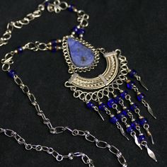 🌟 Elevate Your Style with our Blue Stone and Metalwork Necklace Collection 🌟 Discover the allure of true craftsmanship with our exquisite Blue Stone Necklace, Metalwork Wire Necklace, and Sodalite Stone Jewelry. Each piece is a masterpiece in its own right, created to enhance your elegance and make a statement of your individuality. 💙 Blue Stone Necklace: A Symphony of Elegance 💎 Our Blue Stone Necklace embodies the essence of serenity and style. The rich blue stone centerpiece is carefully Blue Gemstone Beads Necklace, Blue Kyanite Gemstone Bead Necklaces, Blue Kyanite Gemstone Beaded Necklace, Blue Kyanite Gemstone Necklace, Handmade Sapphire Kyanite Necklace, Bohemian Blue Gemstone Jewelry, Handmade Sapphire Necklace In Kyanite, Blue Beaded Necklaces With Stones For Jewelry Making, Bohemian Sapphire Necklaces With Natural Stones