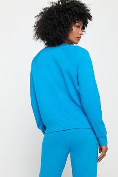 When your Crew Neck feels this good, you'll find any excuse to throw it on. Meet the Hamsa Forever Crew, a relaxed-fit layer equally ready for post-workout or the main event. Softness like no other Classic crew neck and raglan sleeve Relaxed fit with room to move Elevated rib edge detail Puff printed Hamsa graphic | Hamsa Forever Crew in Azul Spring Relaxed Activewear For Workout, Relaxed Spring Activewear For Workout, Relaxed Spring Workout Activewear, Sportswear Tops With Ribbed Waistband And Relaxed Fit, Sporty Sweatshirt For Sports Season Loungewear, Sporty Sweatshirt For Loungewear During Sports Season, Relaxed Cotton Activewear For Sports, Go-dry Crew Neck Athleisure Activewear, Sporty Go-dry Crew Neck Activewear