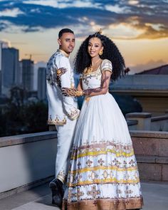 Description Revel in the enchanting splendor of Ethiopian tradition with our exquisite couples' outfit, meticulously designed to evoke timeless elegance and cultural richness. Crafted in shimmering brown and yellow hues, this ensemble radiates a captivating allure, accentuated by intricate sparkling details that dance in the light. The harmonious blend of colors and textures celebrates the deep-rooted heritage of Ethiopia while exuding a modern charm. Perfectly coordinated for couples, this ensemble embodies unity and togetherness, making it an ideal choice for weddings, cultural events, or any special occasion where you want to make a memorable statement. Embrace the spirit of love and tradition with this stunning Habesha couples' outfit, a symbol of enduring beauty and shared heritage. M Traditional Wedding Gown With Traditional Patterns, Habesha Kemis For Wedding And Eid With Traditional Patterns, Fitted Habesha Kemis For Wedding And Eid, Fitted Habesha Kemis For Wedding Eid, Traditional Wedding Dress For Ceremonies, Traditional Marriage Sets With Intricate Embroidery, Festive Ceremonial Fitted Habesha Kemis, Traditional Habesha Kemis For Wedding And Eid, Traditional Patterned Gown For Wedding And Eid