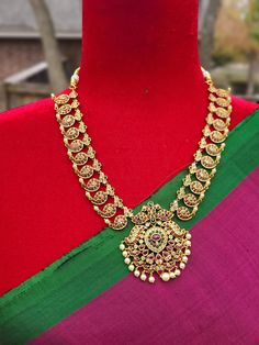 Add charm and charisma to your beautiful personality with these beautifully designed and handcrafted Brass necklaces. The antique finish gives this Necklace a very eye-catching look. Long necklace designed beautifully and compliments very well. Wear it with any of your party or casual outfits and grab compliments all the way! Antique Gold Temple Necklace With Intricate Design As Gift, Festive Gold Necklace With Peacock Design, Ceremonial Temple Jewelry Long Necklace, Gold Oxidized Jewelry For Diwali, Brass Necklaces With Intricate Design For Celebration, Gold Jewelry With Oxidized Finish For Diwali, Gold Chandbali Bridal Necklace In Bohemian Style, Gold Oxidized Temple Jewelry Necklace, Temple Jewelry Gold Necklace With Oxidized Finish