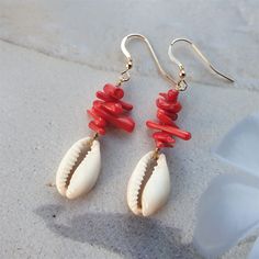 Beautiful cowrie shell earrings with red coral chips are beachy coral earrings, ocean earrings or red coral earrings- made of 6-15mm bamboo chip beads and a cowrie shell bead. These coral beads are made of bamboo. Bamboo is a whitish marine plant, dyed to imitate coral. Coral is the absolute summer stone and color and it is a perfect sea inspired jewelry, coral jewelry,shell jewelry, cowrie jewelry, beach jewelry or summer jewelry. Perfect gift for her or beachlover gift NB! The listing is for o Coral Earrings For Summer Beach Occasion, Coral Earrings For Beach Summer, Coral Earrings For Beach And Summer, Summer Beach Coral Earrings, Dangle Cowrie Shell Earrings For Beach, Beach Cowrie Shell-shaped Earrings, Shell Earrings For Beach Season Gift, Beach Season Shell Earrings Gift, Handmade Red Coral Jewelry For The Beach