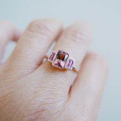 Charlotte Radiant Pink Tourmaline and Sapphire Ring, emerald cut bezel 3 stone ring, three stone wedding ring, classic engagement ring Pink Tourmaline Engagement Ring, Tourmaline Engagement Ring, Wednesdays We Wear Pink, Popular Rings, Pink Tourmaline Ring, Pink Sapphire Ring, 3 Stone Rings, Classic Engagement Rings, Rose Gold Pink