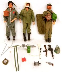 two action figures are posed next to each other with tools and equipment on the table