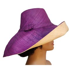 A beautiful shape-able lightweight raffia hat featuring a 7-inch brim that we weave by hand in Madagascar. Its shape-able brim allows the owner to wear the hat in many different styles. This adjustable hat is an eco-friendly product crafted from natural Raffia and other renewable and sustainable raw materials utilizing a variety of energy saving techniques. It contains a comfortable cotton lining with an adjustable drawstring in its interior. All of the colorings on this hat were done using a long-lasting vegetable-based dye. Its dual layer of fine woven Raffia allows the hat to offer UPF 50+/SPF 30+ sun protection which makes it a great hat for when you will be outdoors for an extended period of time. Our big brim Madagascar raffia hats are pack-able & are folded or rolled easily for trav Handwoven Wide Brim Hat For Kentucky Derby, Handwoven Brimmed Straw Hat For Kentucky Derby, Handwoven Toquilla Straw Sun Hat With Curved Brim, Purple Short Brim Sun Hat For Summer, Elegant Palm Leaf Hat With Curved Brim, Purple Wide Brim Hat For Summer, Handwoven Curved Brim Straw Hat For Kentucky Derby, Woven Straw Hat With Curved Brim For Kentucky Derby, Kentucky Derby Wide Brim Straw Hat