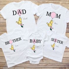 All our baby bodysuits and toddler T Shirts are made using Gerber brand. ONESIES® Brand trademark is owned by Gerber Childrenswear LLC Please note listing is for one shirt only (if you require more than one, please return to listing and repeat for each shirt) Capture the essence of childhood wonder and togetherness with our matching family shirts featuring beloved Classic Pooh illustrations. Each shirt is personalized with names, making them a delightful choice for family outings and special occ Pooh And Mickey Sharing Shirt, Family Cartoon Print Crew Neck Tops, Family Crew Neck Tops With Character Print, Fun Character Print Tops For Family Events, Family Matching Cartoon Print Cotton Tops, Family Matching Character Print Cotton Tops, Family Matching Cotton Tops With Cartoon Print, Family Matching Cotton Tops With Character Print, Family Matching Cotton Shirt With Character Print