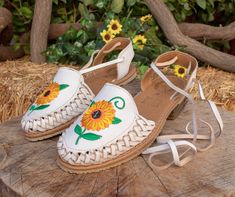 Womens sunflower embroidered leather closed toe lace up flat mexican sandals -color white Chanclas Mexican, Summer Huarache Sandals With Rubber Sole, Spring Lace-up Huaraches, Spring Festival Huarache Sandals With Round Toe, Summer Adjustable Slip-on Huaraches, Adjustable Slip-on Summer Huaraches, Spring Huaraches With Rubber Sole And Flat Heel, Spring Huaraches With Adjustable Rubber Sole, Spring Flat Heel Huaraches With Rubber Sole