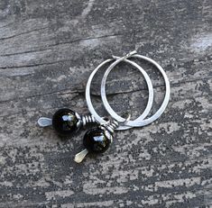 "🌟PLEASE READ the following description before making your purchase.  Note measurements and size reference photos. ½\" sterling silver hoops with removable 6mm black onyx sterling silver dangles. These earrings measure 1.3 inches from the top of the hoop to the bottom of the dangle." Black Sterling Silver Small Hoop Earrings, Handmade Minimalist Small Hoop Earrings, Small Hoop Handmade Earrings As Gift, Dainty Handmade Small Hoop Earrings, Small Hoop Sterling Silver Earrings With Lever Back, Small Hoop Wire Wrapped Silver Earrings, Silver Wire Wrapped Small Hoop Earrings, Handmade Black Sterling Silver Hoop Earrings, Dainty Small Hoop Earrings In Sterling Silver