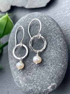 These small classic Pearl drop earrings are dainty and minimal. Dangling from handcrafted sterling silver hoops, they measure a total length of 1.25 inches. These earrings look gorgeous for everyday wear or for stunningly accessorizing a special occasion outfit! EARRING FEATURES Total Length: Approx. 1 1/4 inches Metal: 925 Sterling Silver  Gemstone: 4mm White Freshwater Pearls ♥  Sterling silver is hypoallergenic and safe to wear for those with sensitive skin. ♥  All orders come beautifully han Delicate Round Sterling Silver Pearl Earrings, Delicate Sterling Silver Round Pearl Earrings, Everyday Sterling Silver Pearl Earrings, Everyday Sterling Silver Drop Pearl Earrings, Everyday Sterling Silver Teardrop Pearl Earrings, Sterling Silver Teardrop Pearl Earrings For Everyday, Silver Small Hoop Pearl Earrings, Delicate Sterling Silver Pearl Earrings For Everyday, Silver Small Hoop Pearl Earrings For Everyday