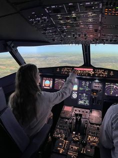 two pilots in the cockpit of an airplane