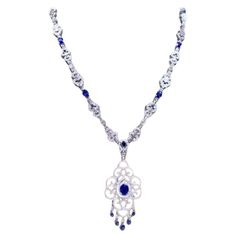 An exquisite necklace in Art Deco design, so particular and refined style, by Italian designer. Necklace come in 18K gold with 13 pieces of natural Ceylon Sapphires of 15.74 carats,in perfect cut, extra fine quality and grade, spectacular color, and 688 pieces of natural diamonds of 9,53 carats, F color VS clarity, very sparkly diamonds, top quality. Piece of high jewelry. Handcrafted by artisan goldsmith. Excellent manufacture and quality of stones. Complete with AIG certificate. Whosale price. Luxury Sapphire Necklace Hallmarked, Luxury Sapphire Necklace For Formal Occasions, Exquisite Gemstone Necklace For Formal Occasions, Exquisite Gemstone Necklaces For Formal Occasions, Exquisite Diamond Necklace Hallmarked, Exquisite Hand Set Pendant Necklace, Exquisite Silver Sapphire Necklace, Luxury Diamond Filigree Necklace, Exquisite Silver Sapphire Necklaces