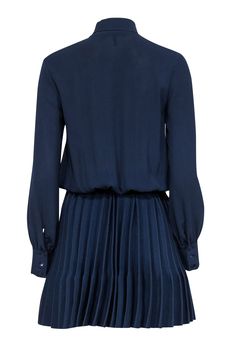 Get ready to turn heads at your next cocktail party with this chic Maje dress! You'll be twirling across the floor in style with precious pleating on the ribbed knit skirt. A playful neck tie completes the look of this gorgeous navy number. Style with neutral pointed-toe pumps for a polished look. Size 4 (Maje 1) Upper 97% Polyester, 3% Elastane Lower 97% Polyamide, 3% Elastane Pullover V-neck w/ neck tie Buttoned cuffs Ribbed knit skirt Pleated skirt Bust 36" Waist (unstretched) 24" Shoulder to hem 37.5" Sleeve length 24" Fitted A-line Dress With Accordion Pleats, Elegant V-neck Pleated Dress For Fall, Fitted Pleated Midi Dress For Cocktail, Fitted Midi Dress With Pleated Hem For Cocktail, Pleated V-neck Dress With Fitted Waist, Chic Pleated Back Dress For Work, Chic Dress With Pleated Back For Work, Fitted Knee-length Pleated Dress For Night Out, Fitted Pleated Dress With Pleated Hem For Work